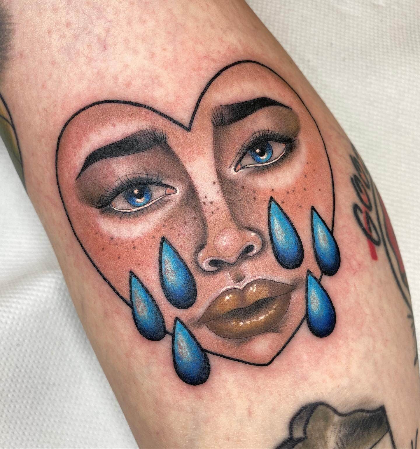 Face And Teardrop Tattoo