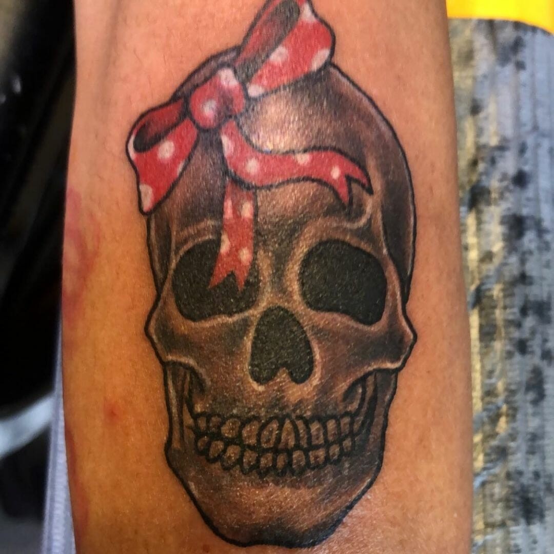 Intriguing Bow Tattoo With A Skull