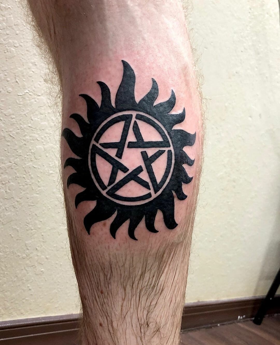 Black Ink Supernatural Tattoo Over Leg