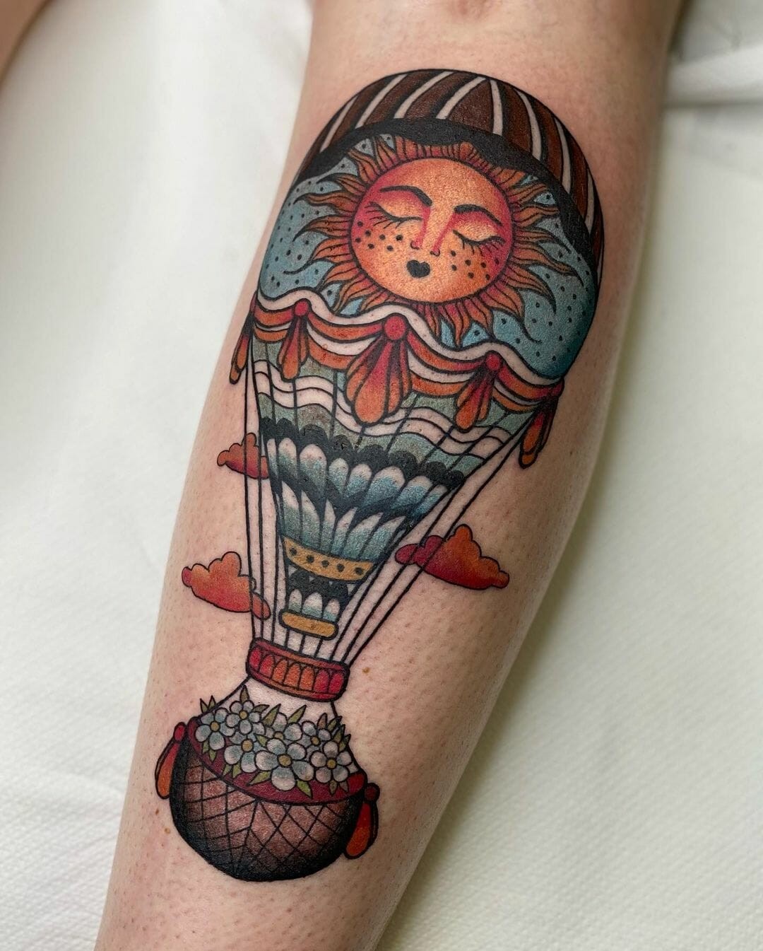 An Orange And Ocean Green Air Balloon Tattoo