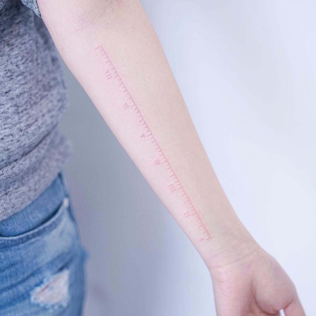 Red Minimalist Ruler Arm Tattoo