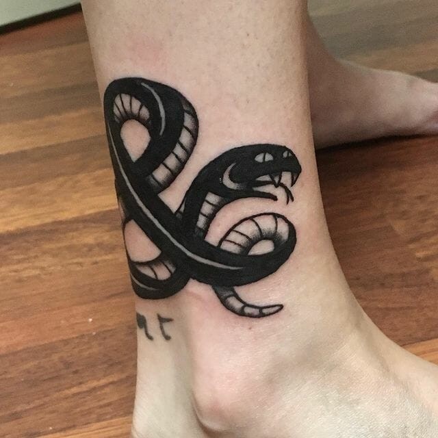 Bold Ampersand Tattoo With Snake Design