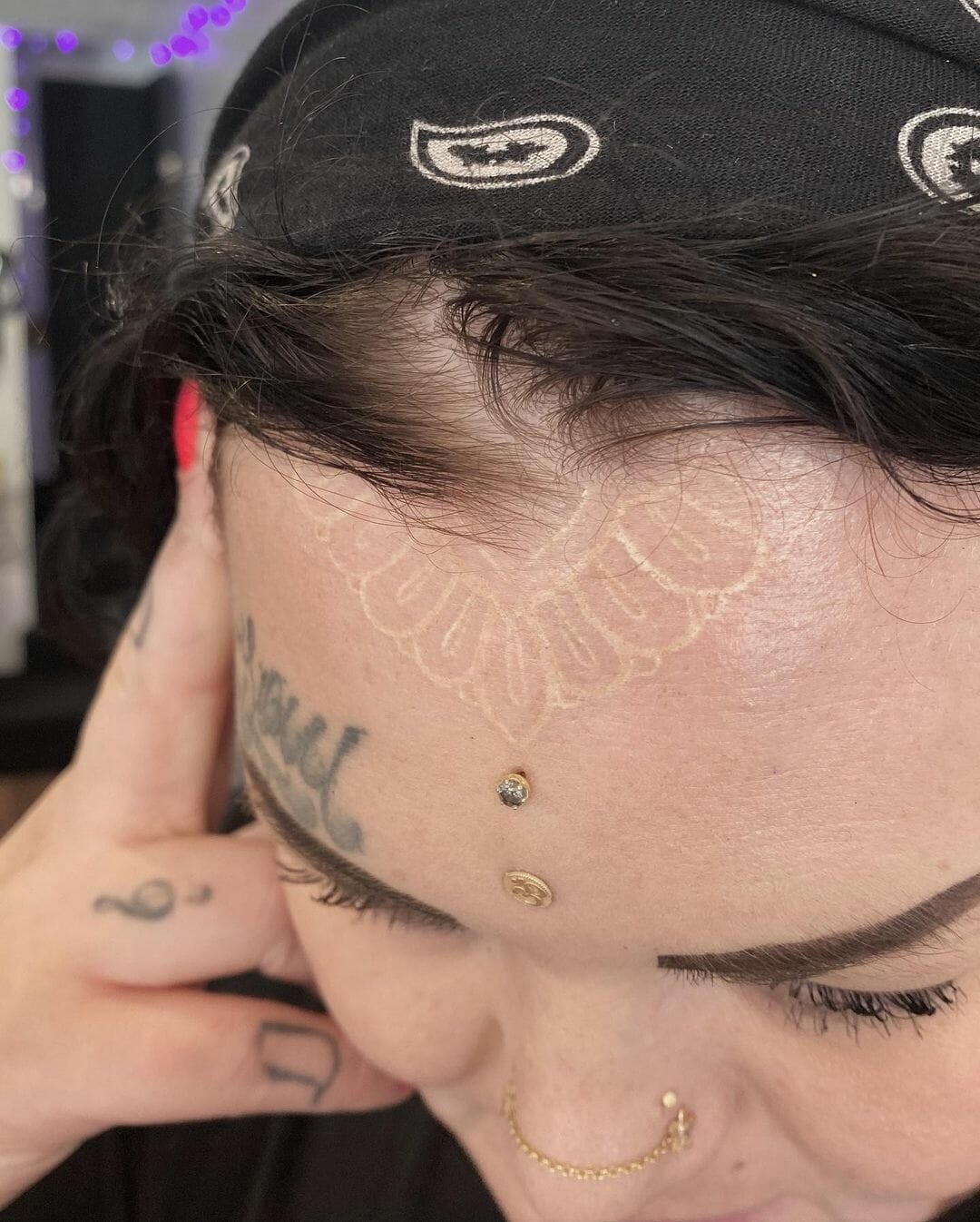 White Forehead Tattoo