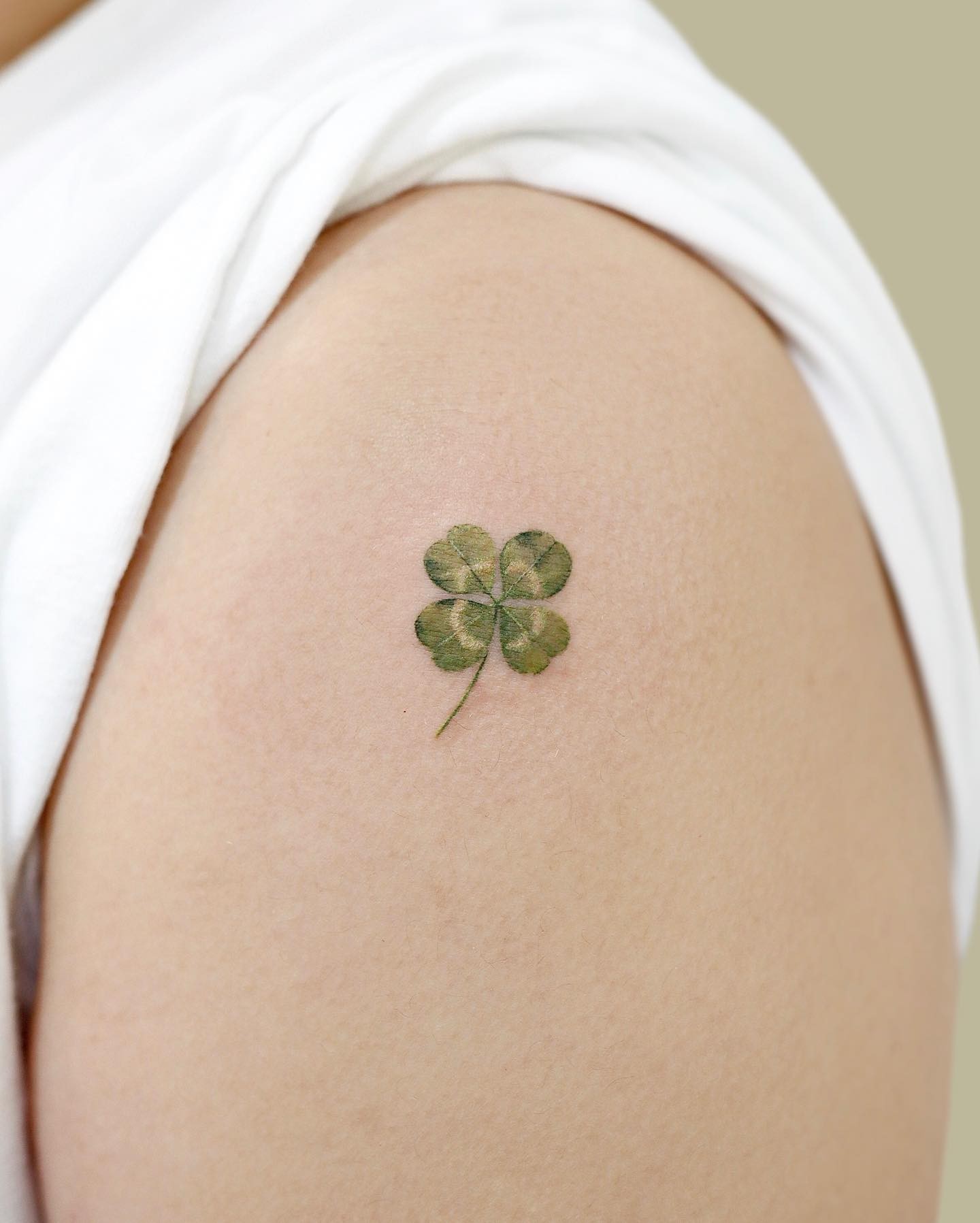 Small Discrete Four Leaf Clover Tattoo on Shoulder