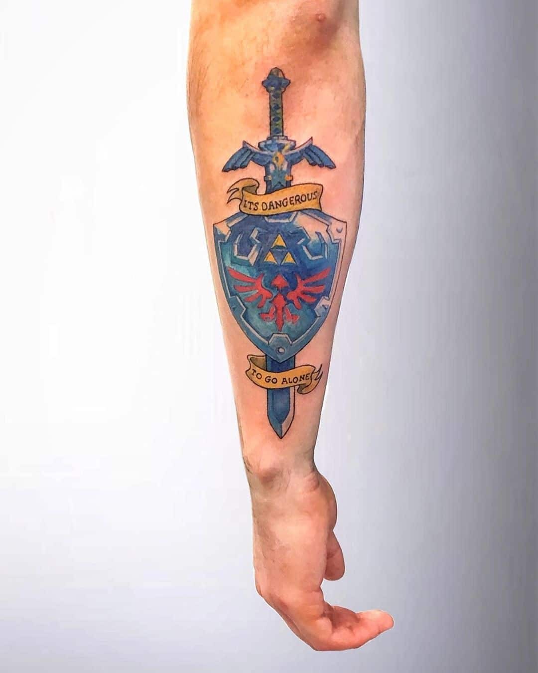 Shield Tattoos Blue Ink Over Forearm