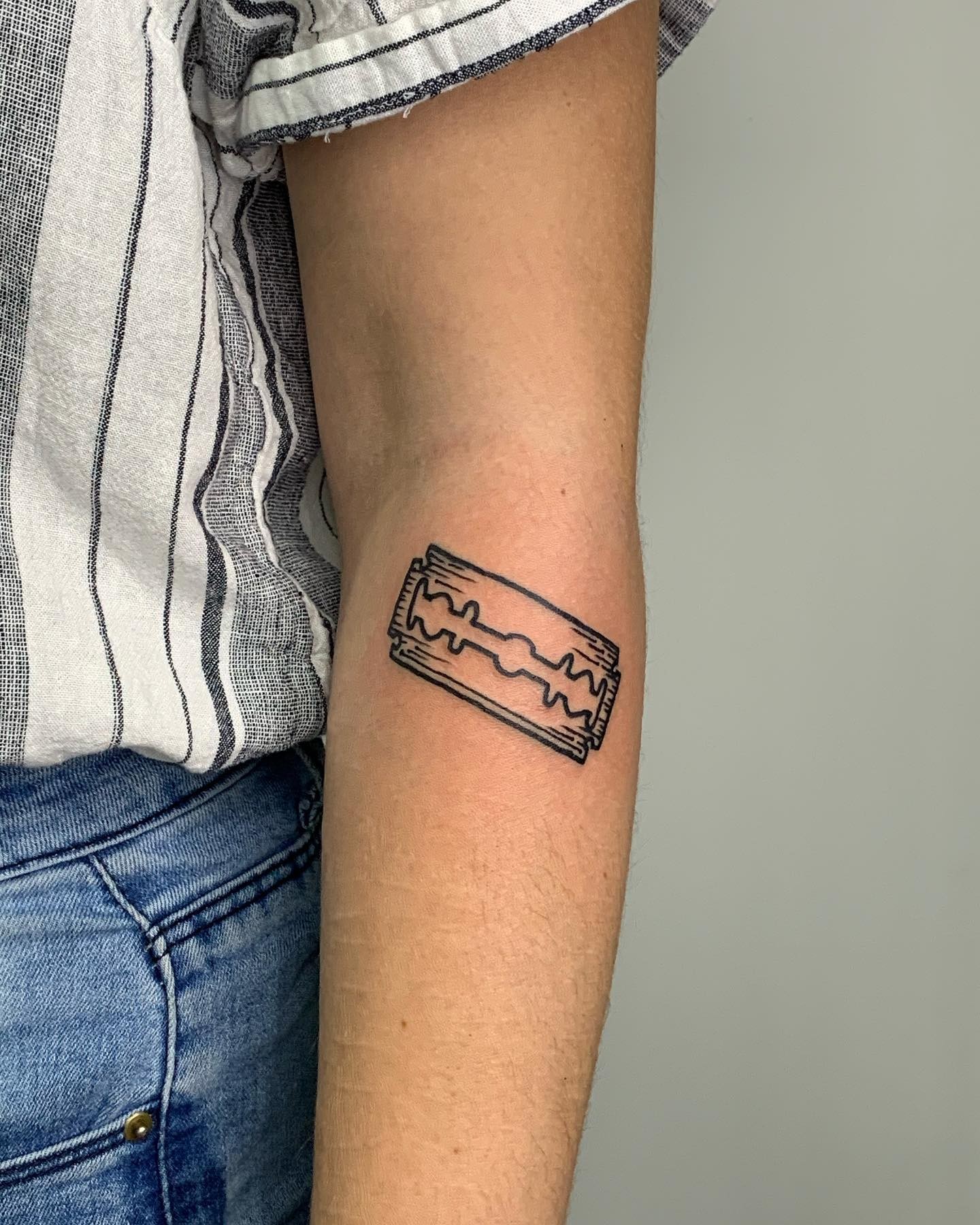 Minimalist Razor Blade Tattoo