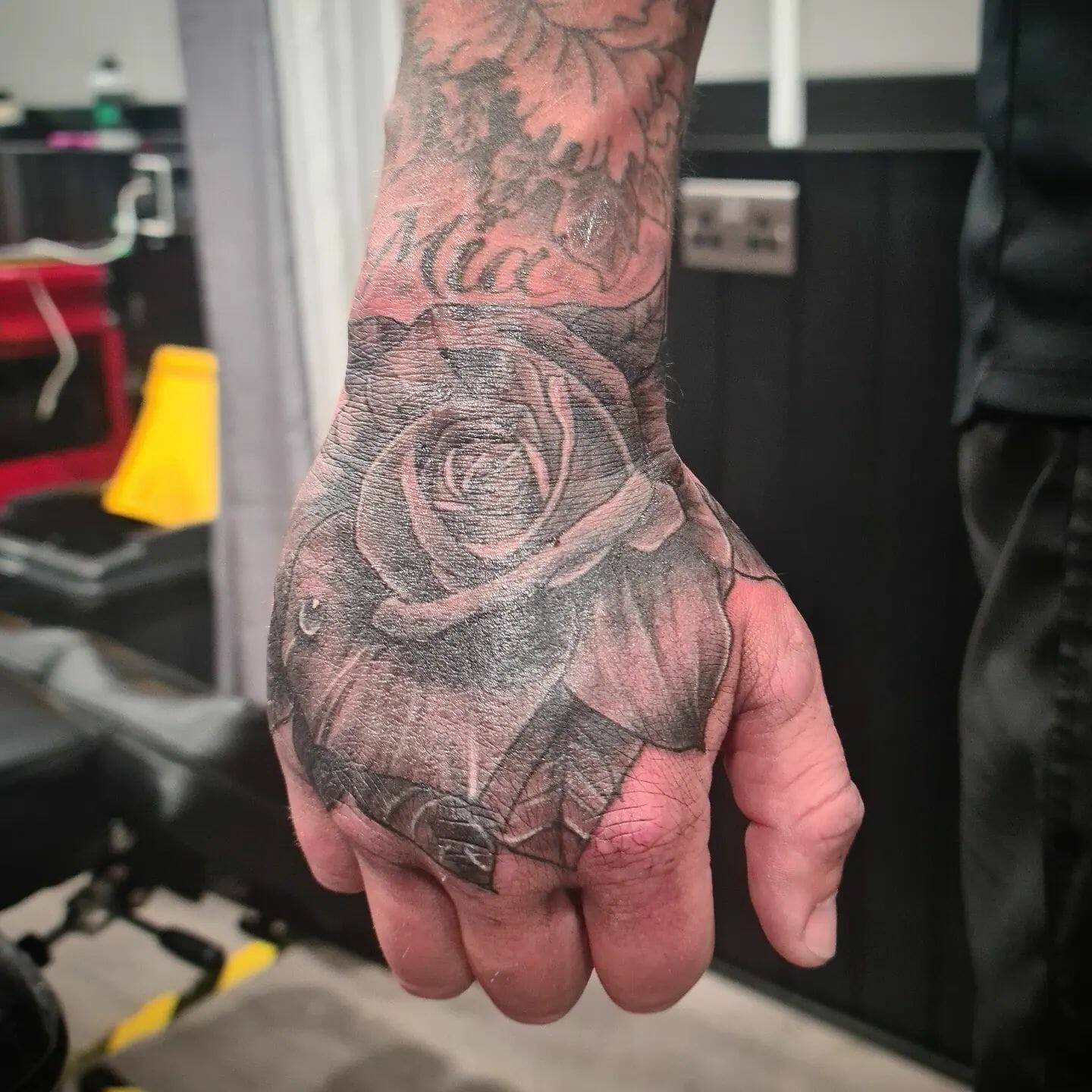 Beautiful Rose Hand Tattoo With Leaves