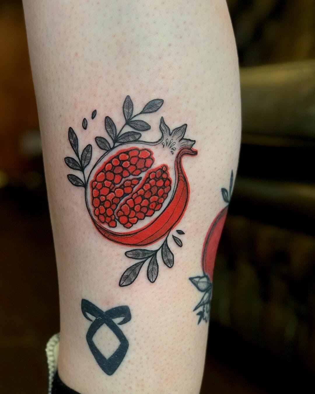 Captivating Pomegranate Tattoo With A Scarlet Splash