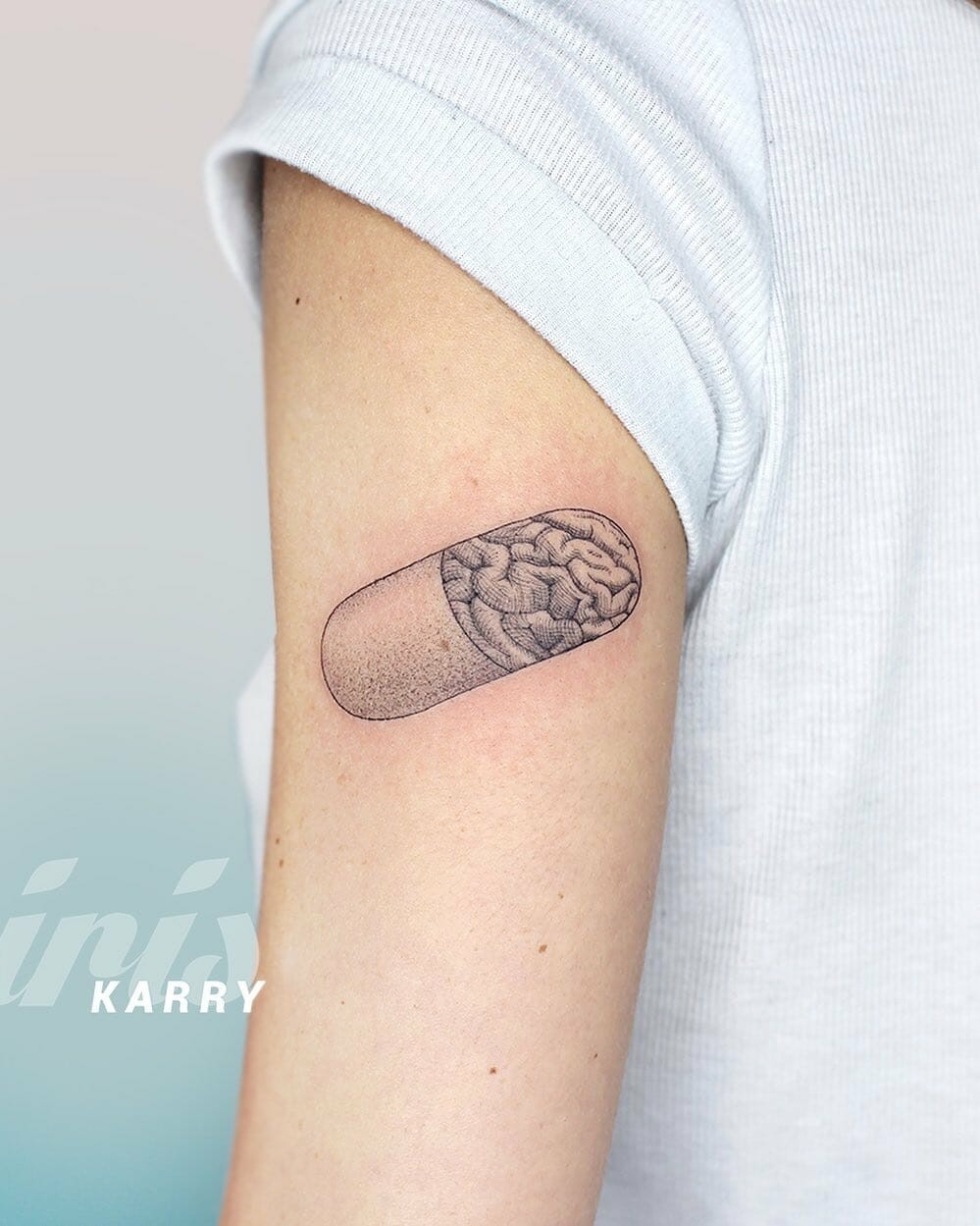 Brain Pill Tattoo On The Upper arm