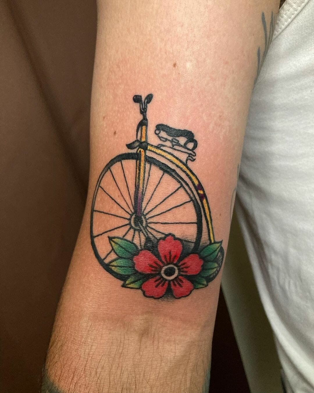 Old School Bicycle Tattoo With A Floral Detail