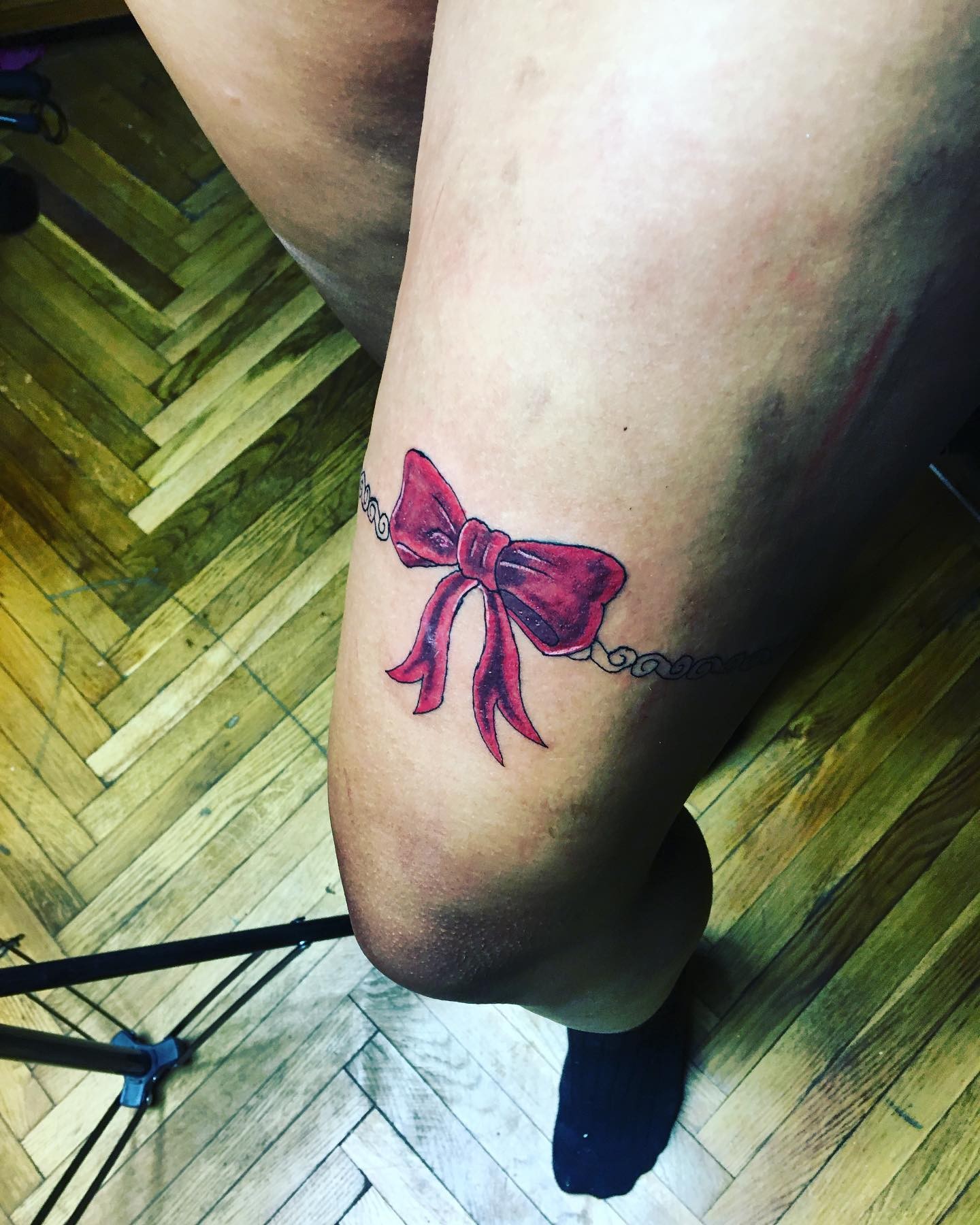 Bright Red Ribbon Bow Thigh Tattoo