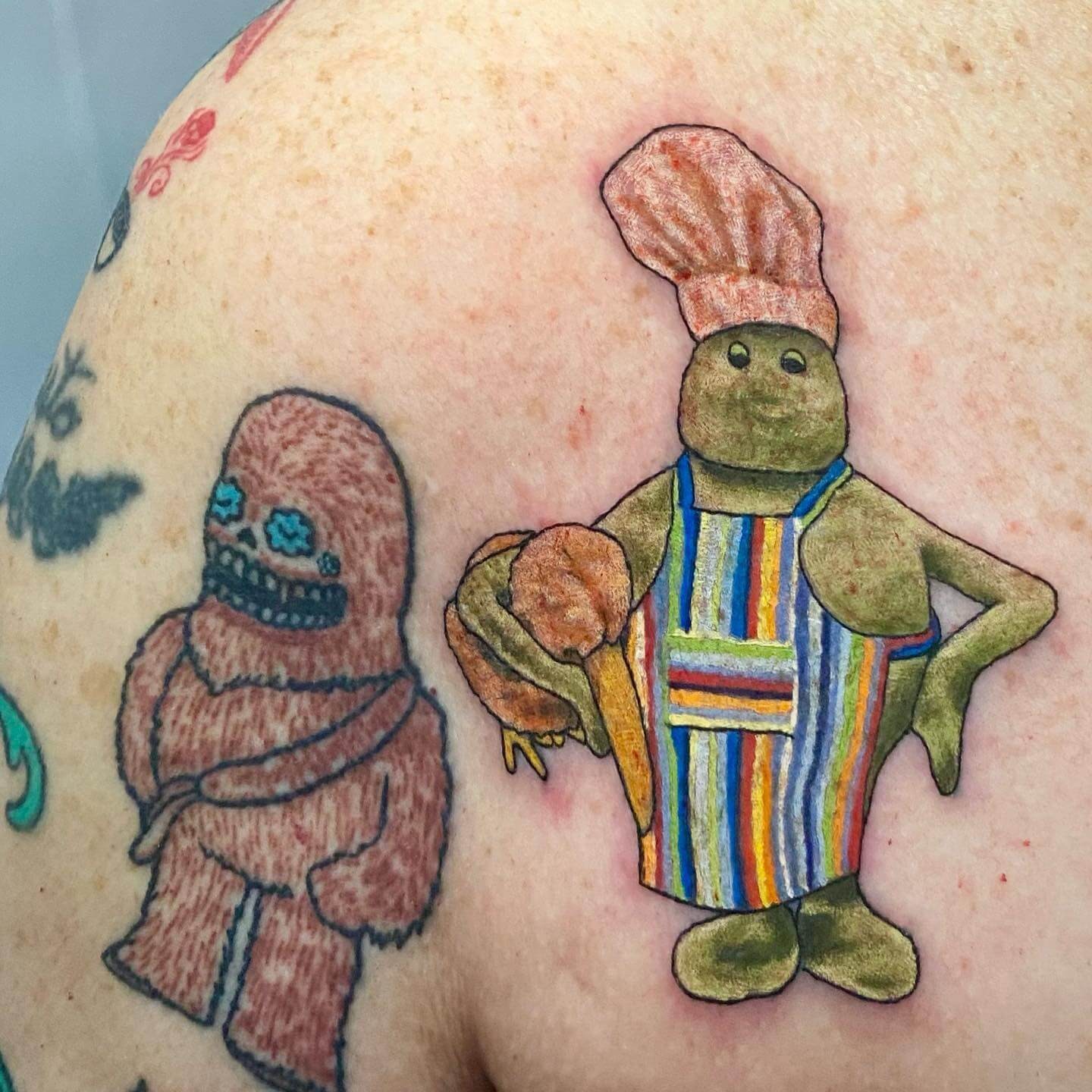 Smiling Small Chef Tattoo On Shoulder