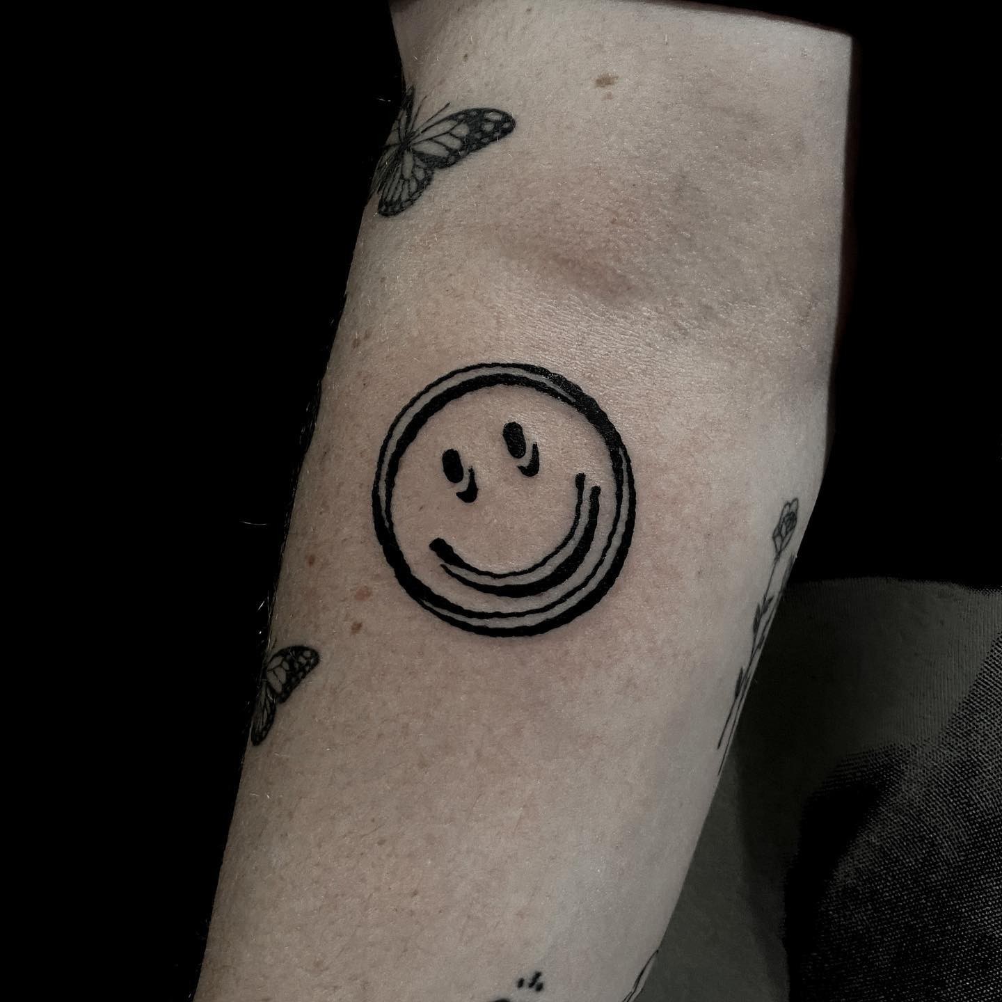 Smiley Face Tattoo