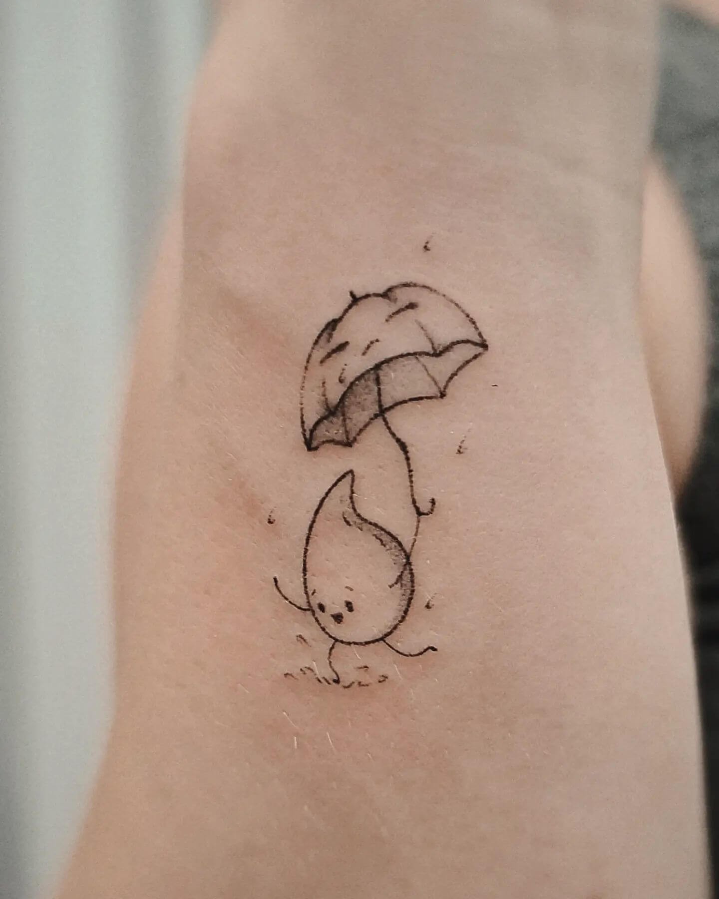 Adorable Raindrop Cartoon Tattoo