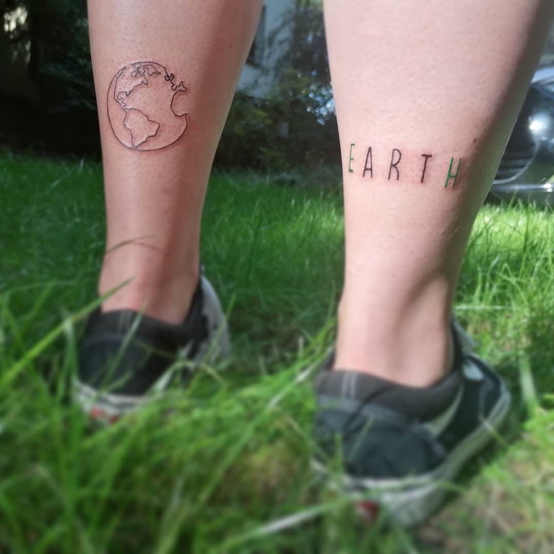 Matching Simple Earth Tattoo in Black Ink