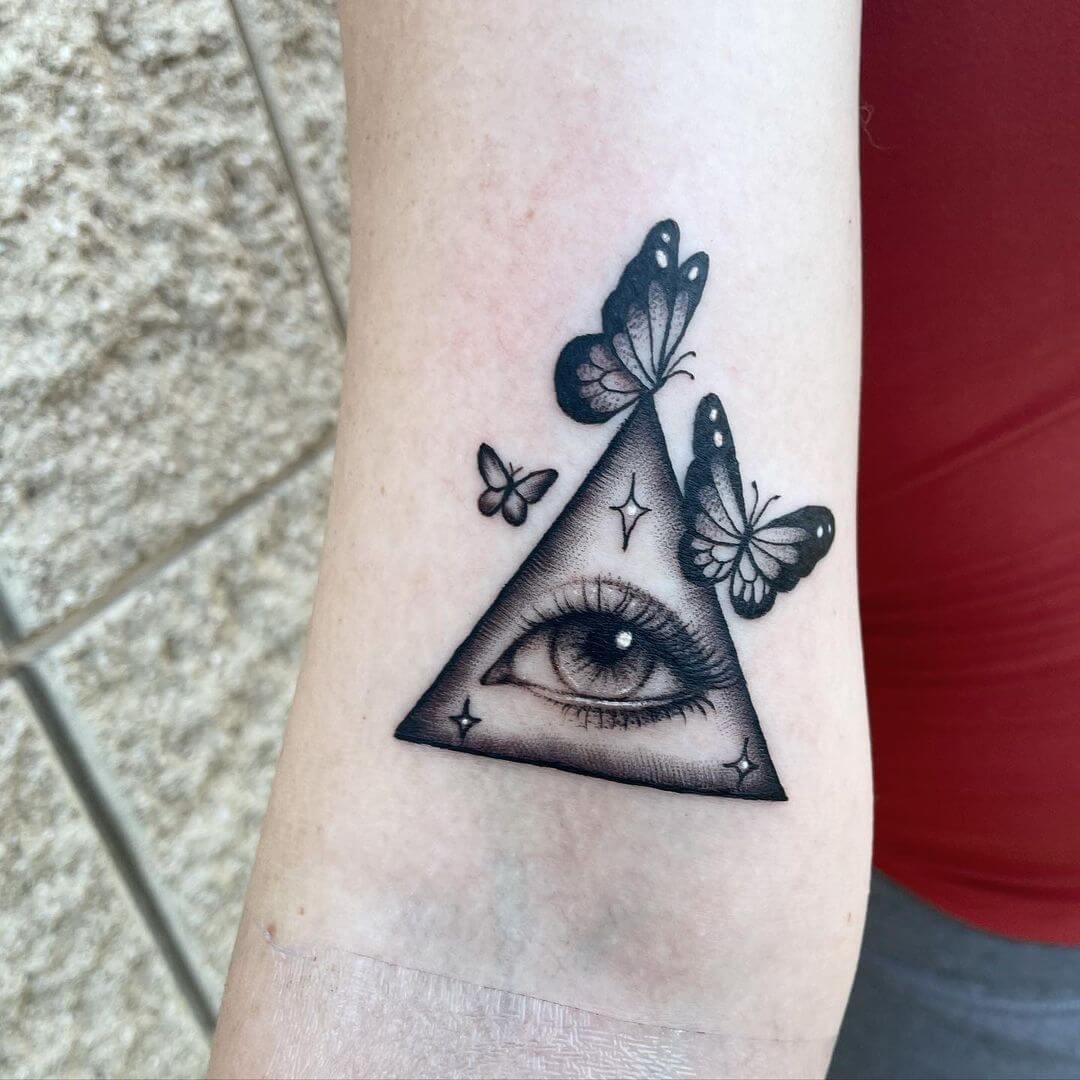 Butterfly Around Evil Eye Tattoo