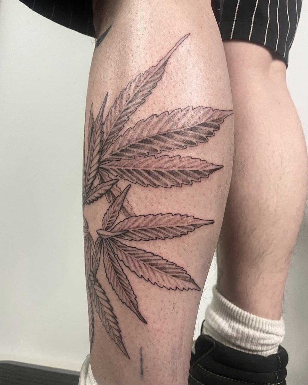 Black And White Leg Marijuana Tattoos