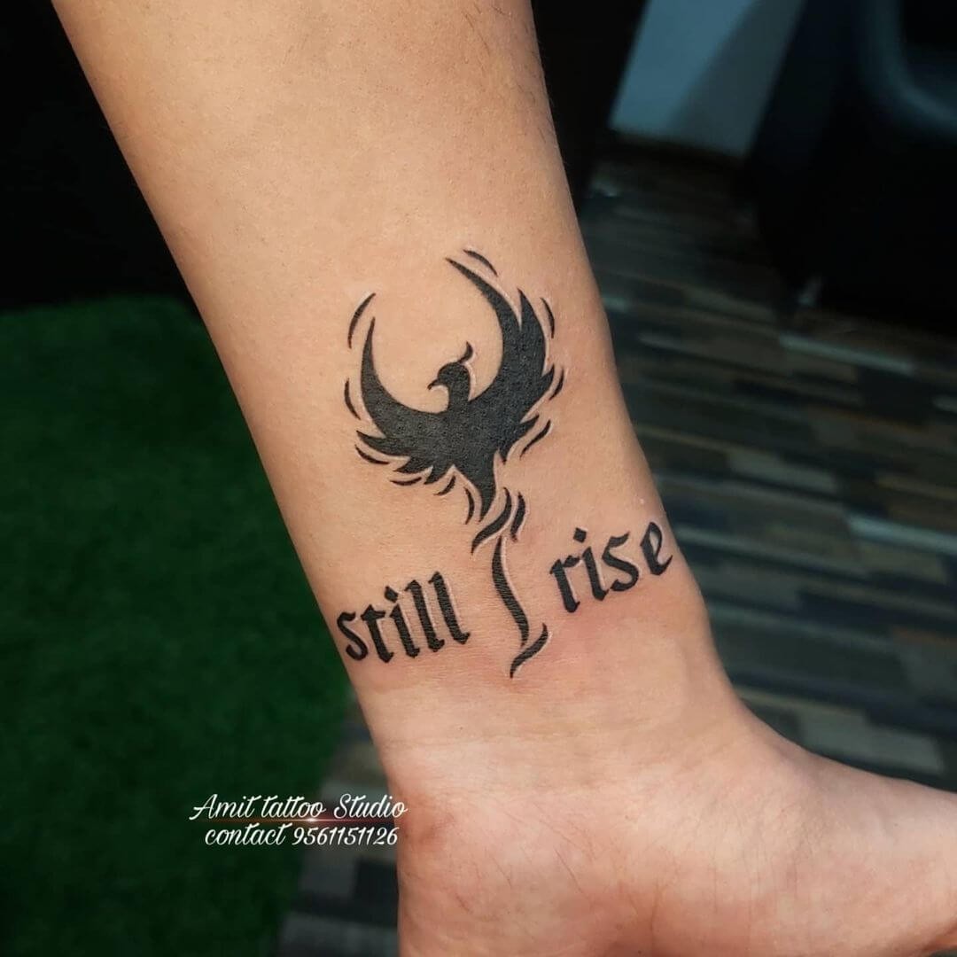 Small & Black Bird Inspired Still I Rise Tattoo