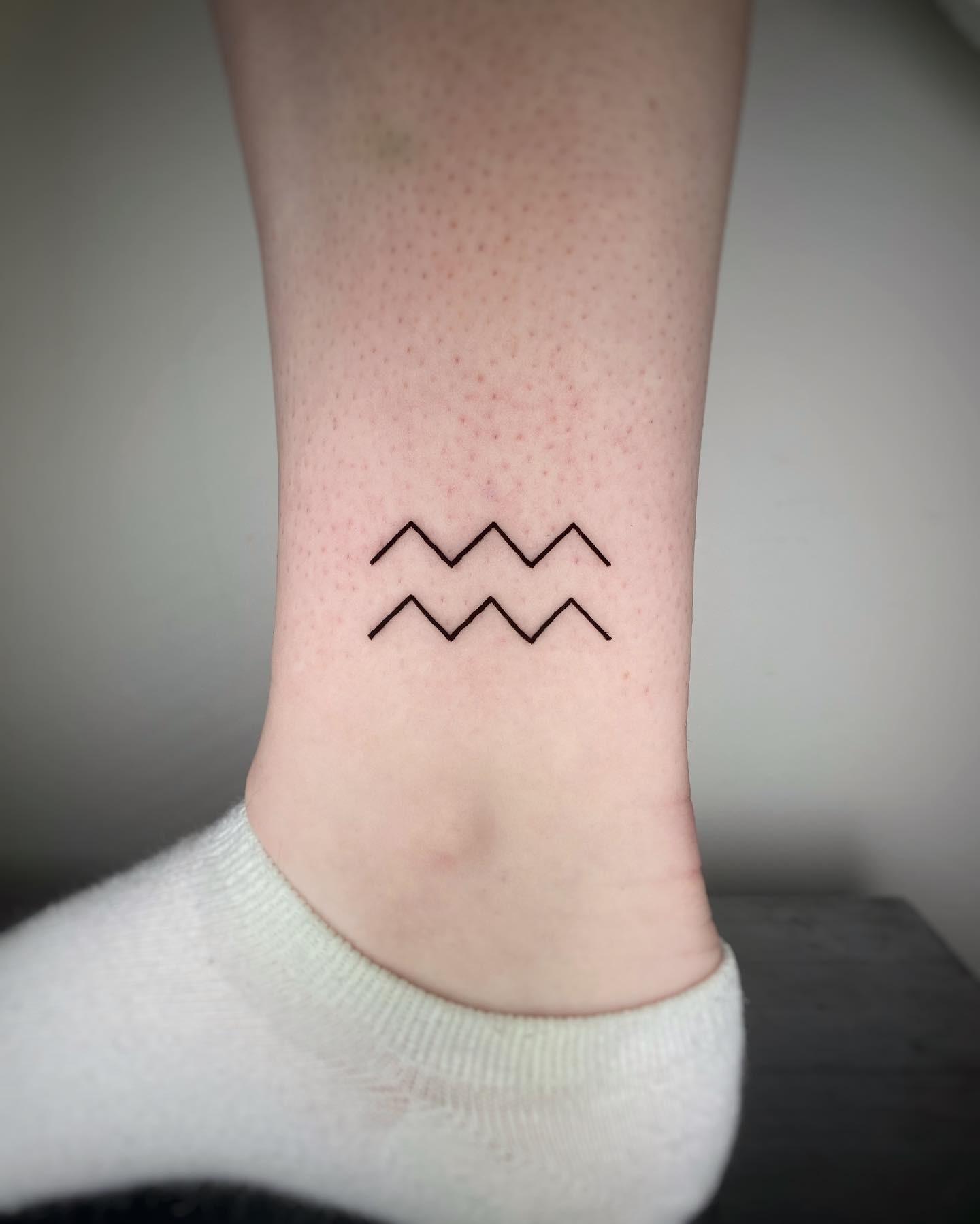 Aquarius Symbol Simple Tattoo