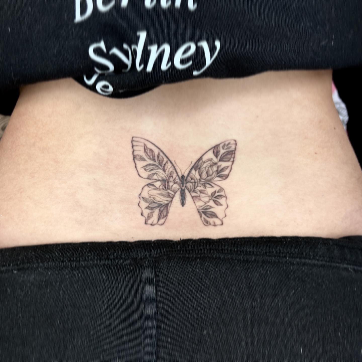 Minimalistic Butterfly Tattoo Lower Back