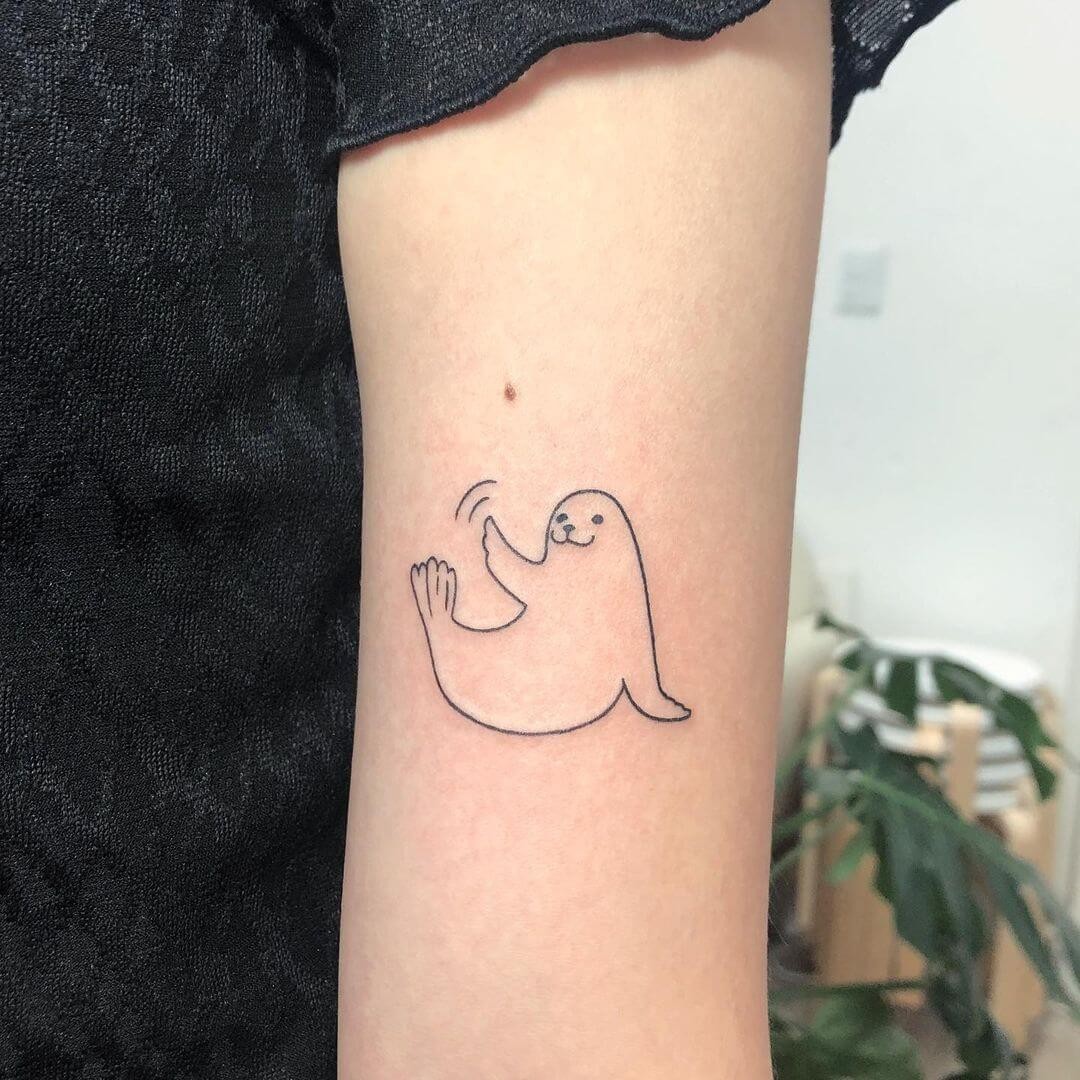 A Simple Line Art Baby Seal Tattoo