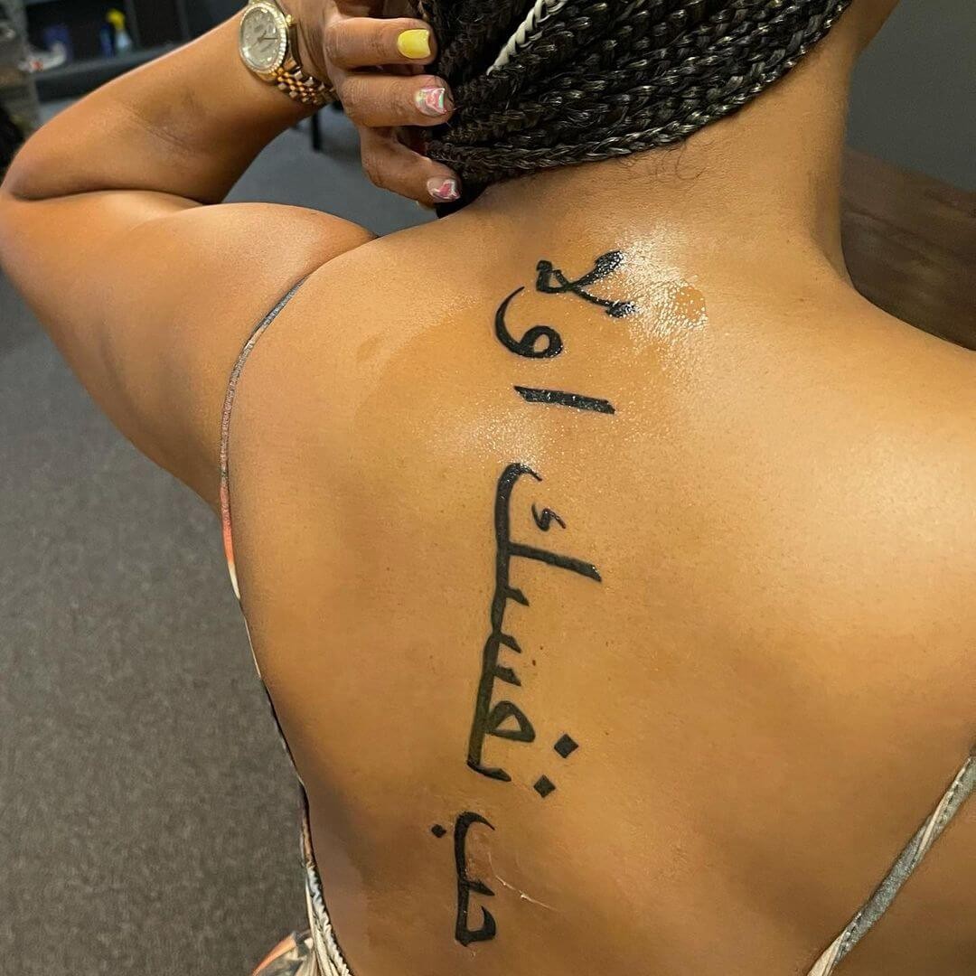 Arabic Spine Tattoo