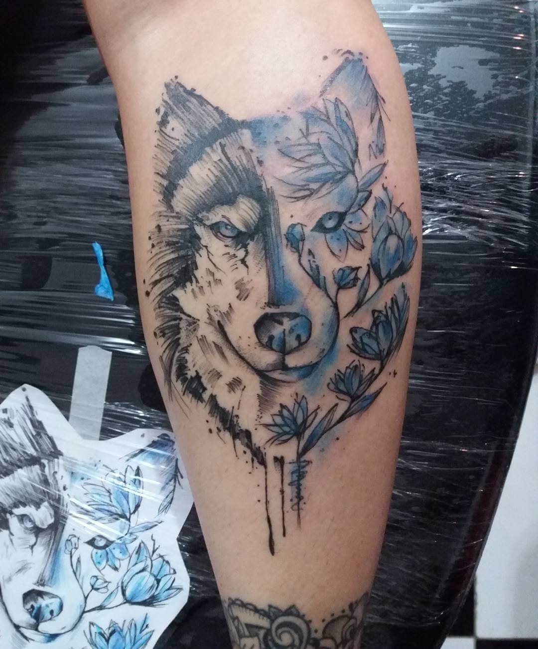 Wolf Inspired Black And Blue Tattoo