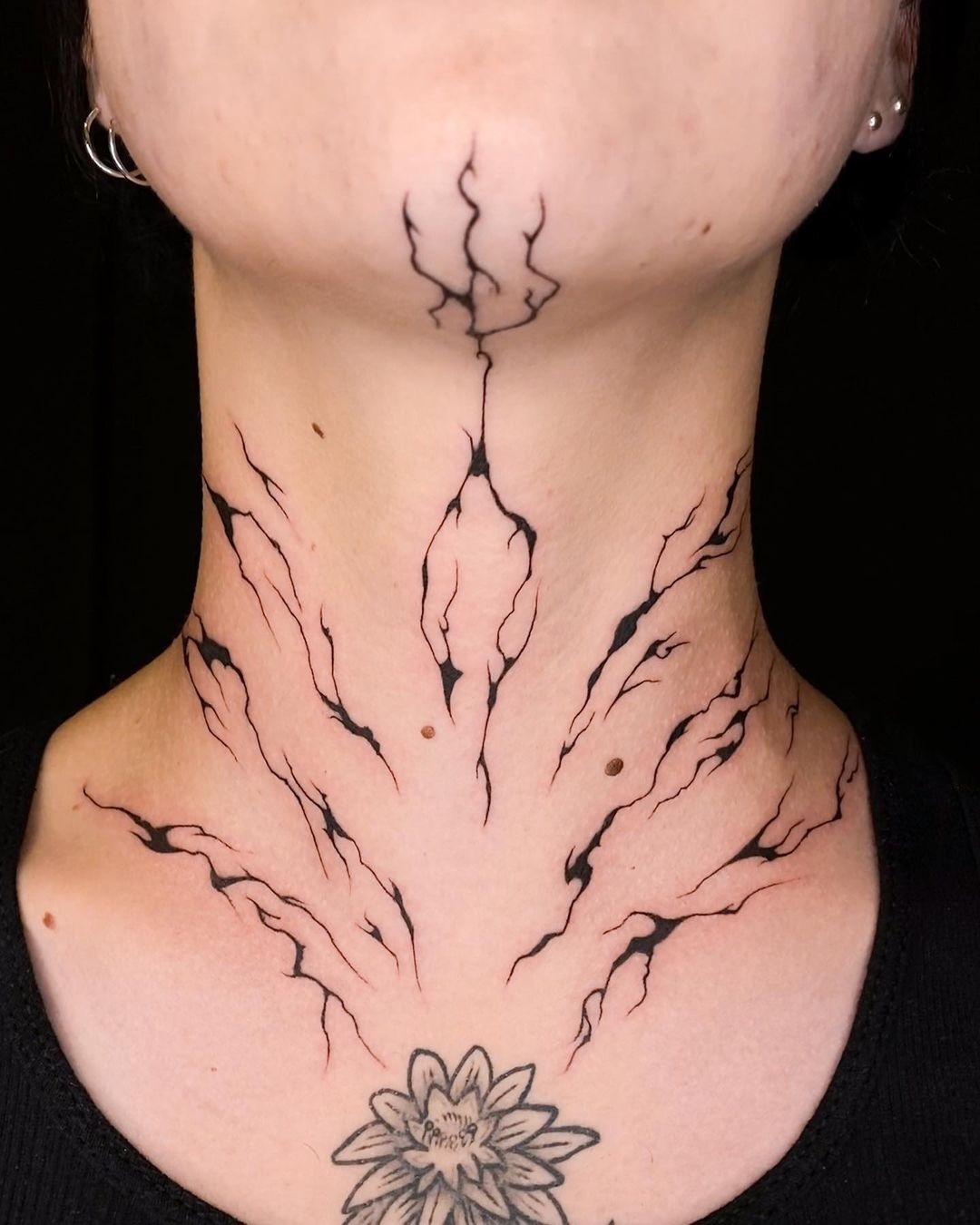 Abstract Chin Tattoo