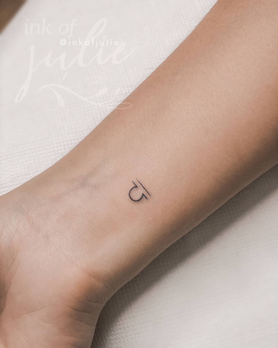 Simple Libra Zodiac Sign Wrist Tattoo