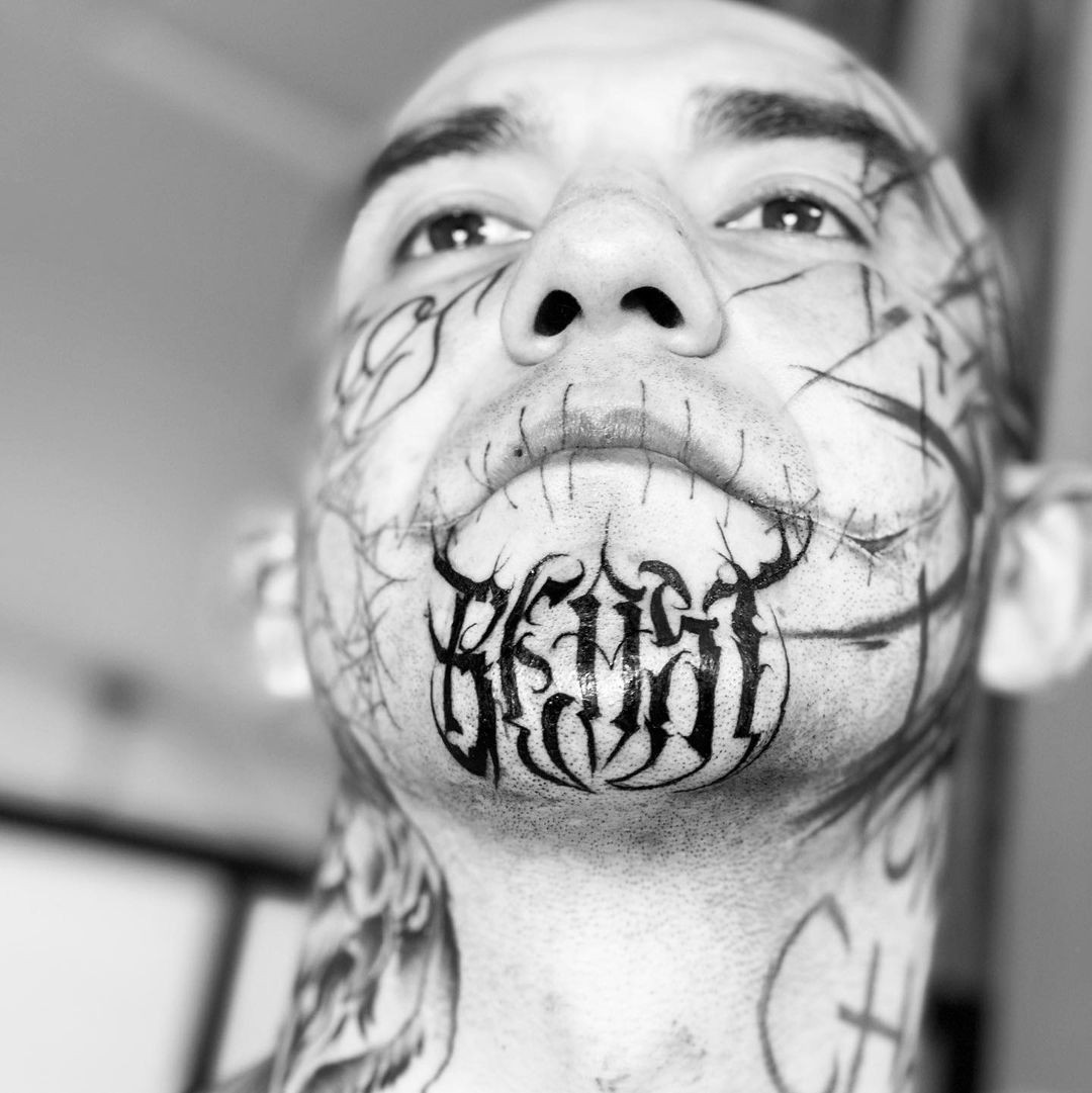 Tribal Chin Tattoo