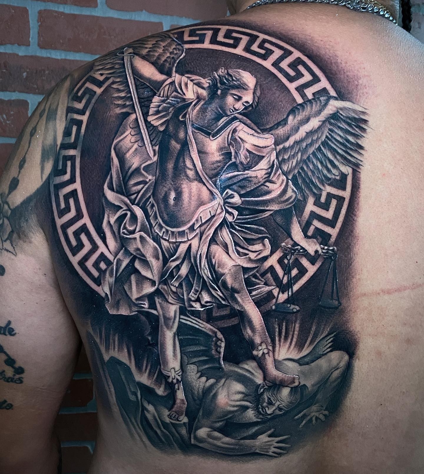 Angels Defeating Satan Back Tattoo