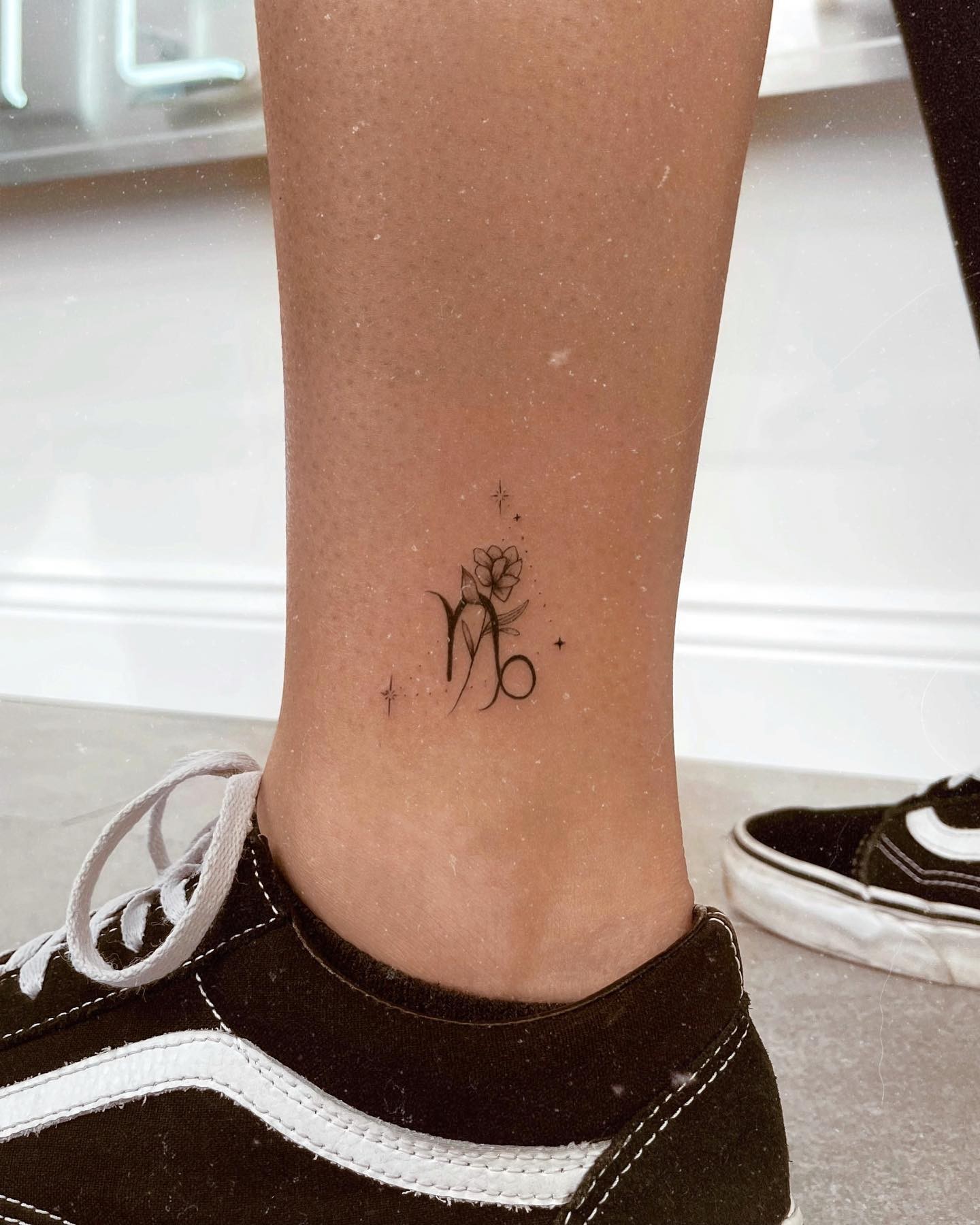 Minimalistic Capricorn Symbol Tattoo Design Ideas