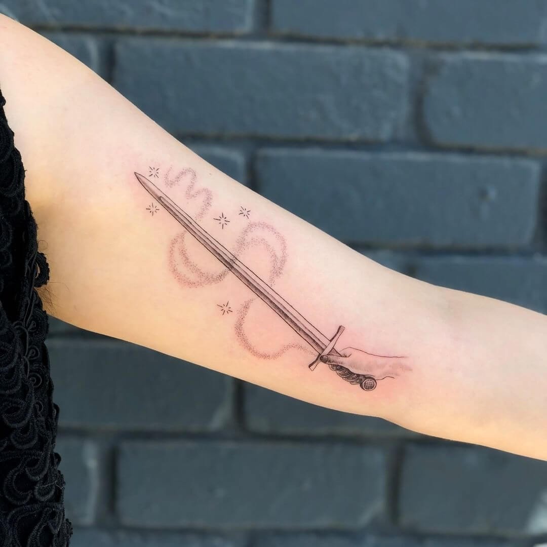 Minimalistic Magical Excalibur Tattoo