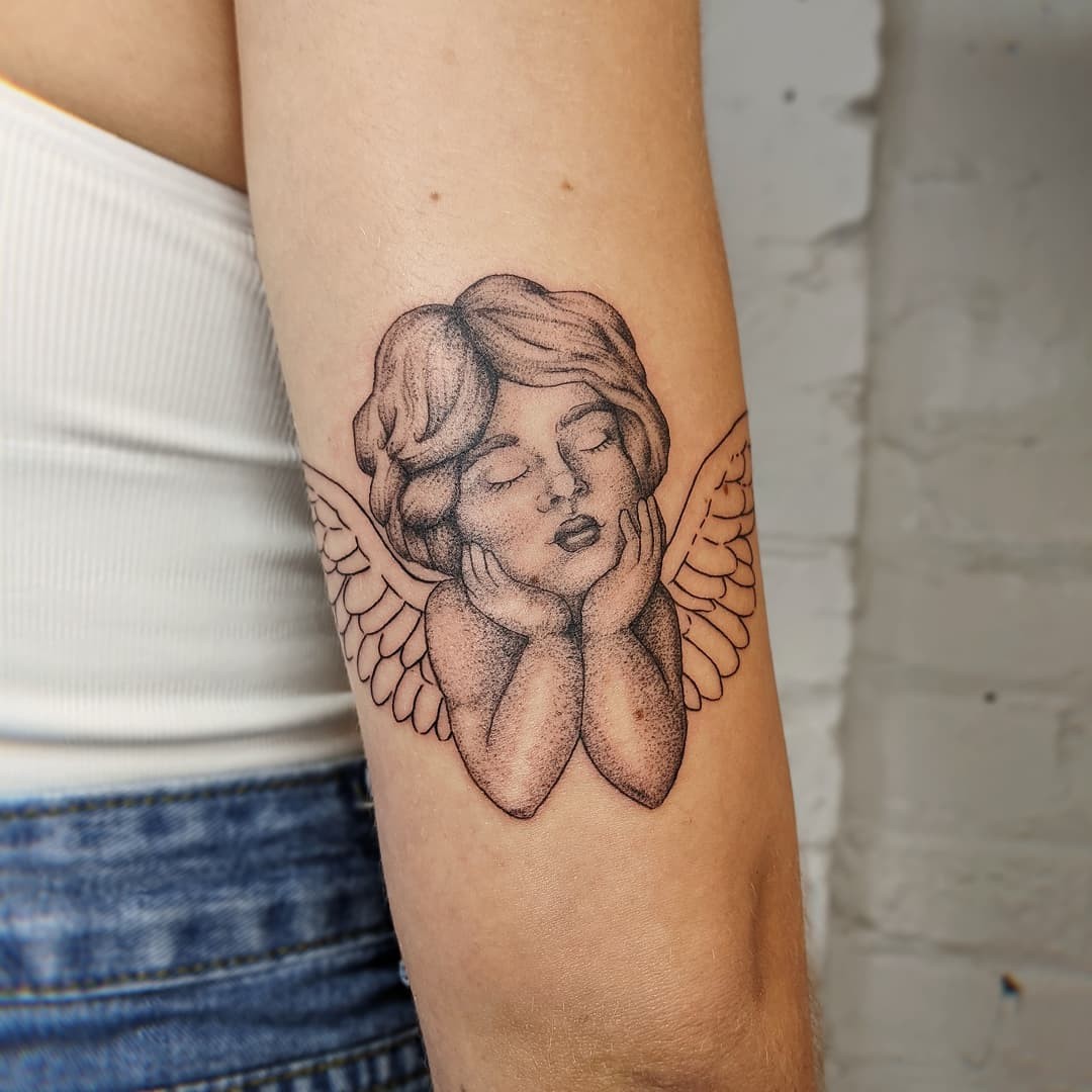 Cherub Angel Tattoo In A Deep Thought