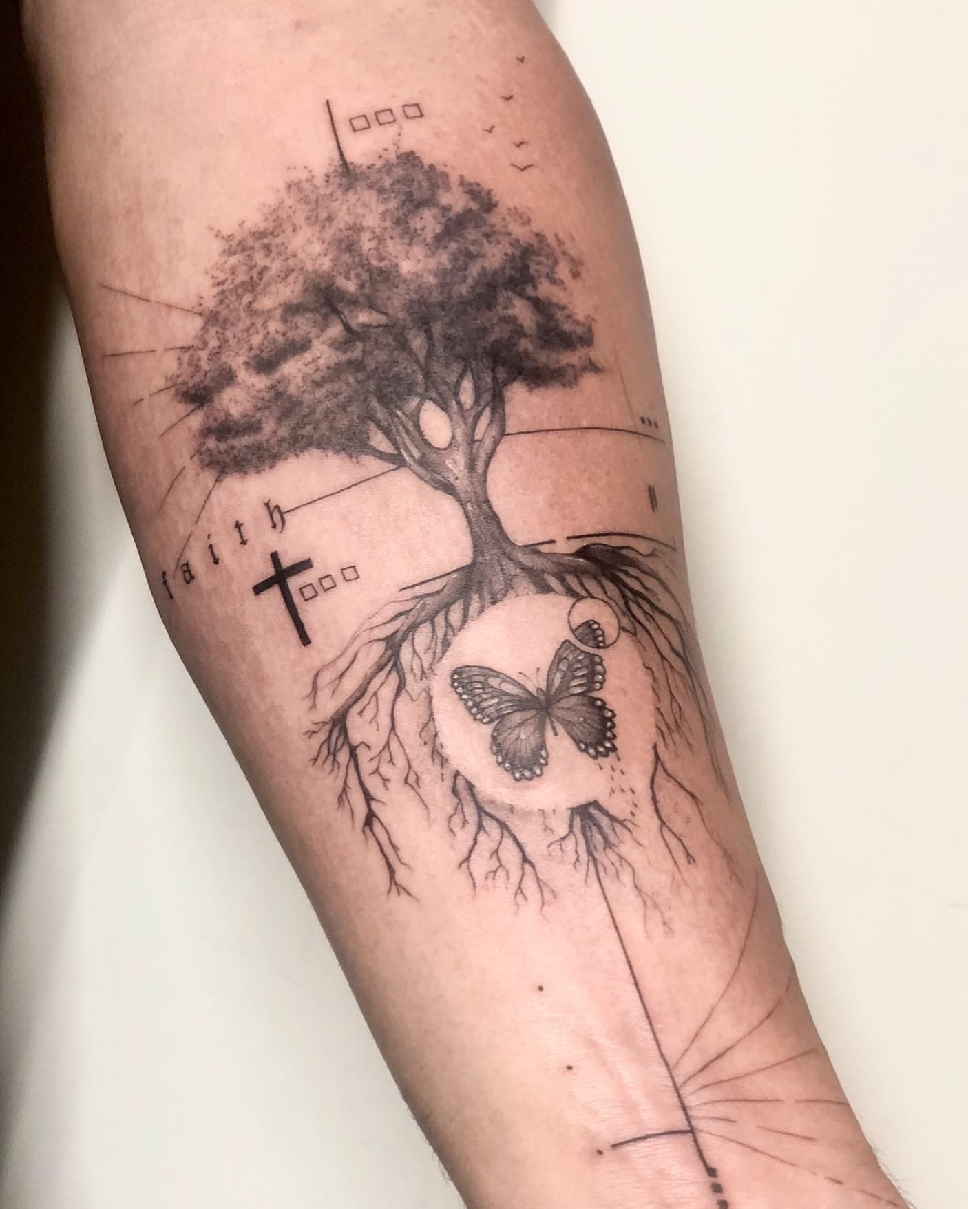 Nature-Themed Cross Tattoo Idea