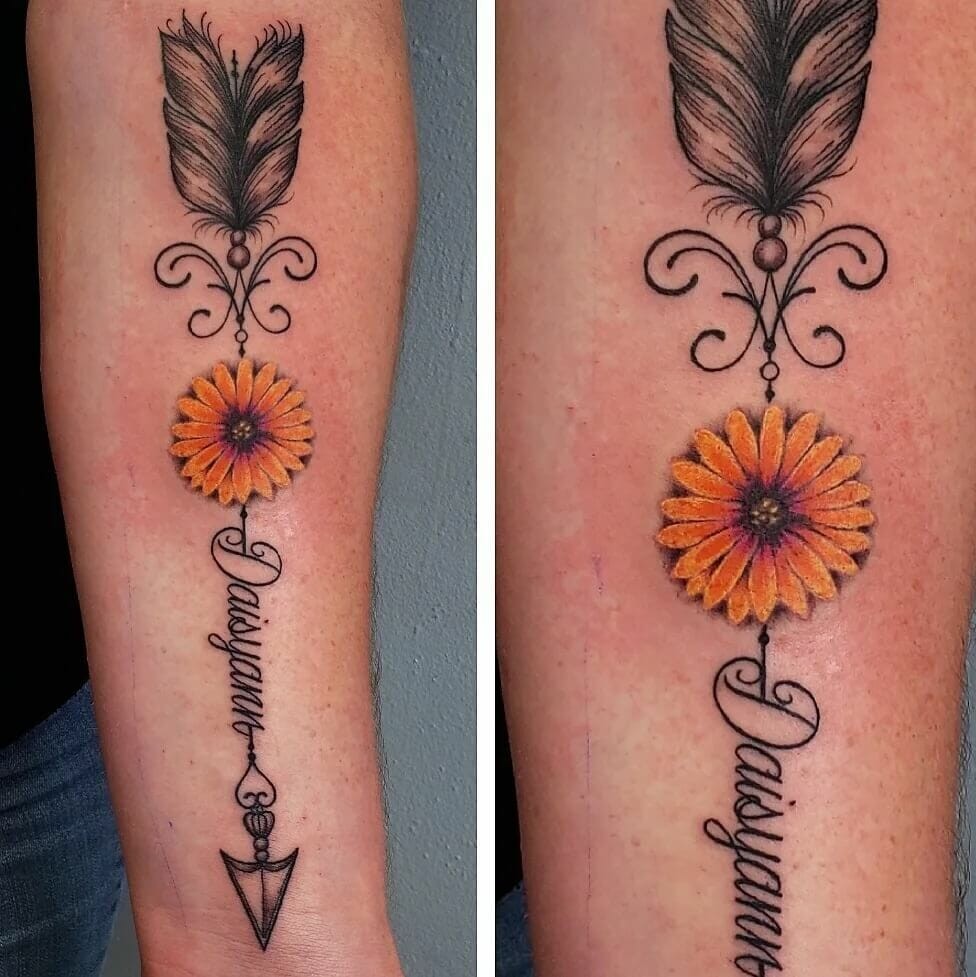 Ornamental Arrow With Name And Daisy Tattoo