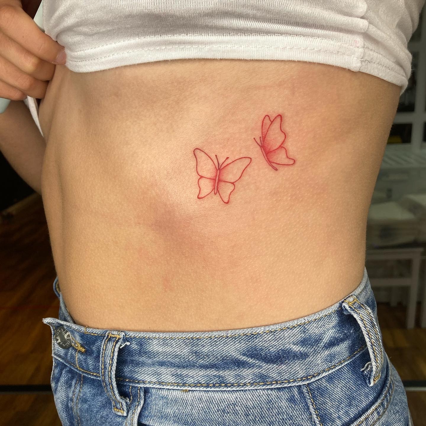 Red Outlined Butterfly Tattoo