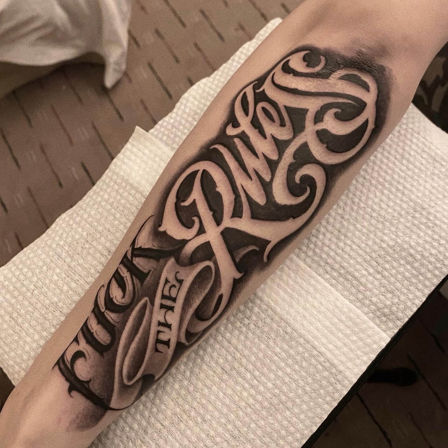 Bold Script Forearm Tattoos For Men