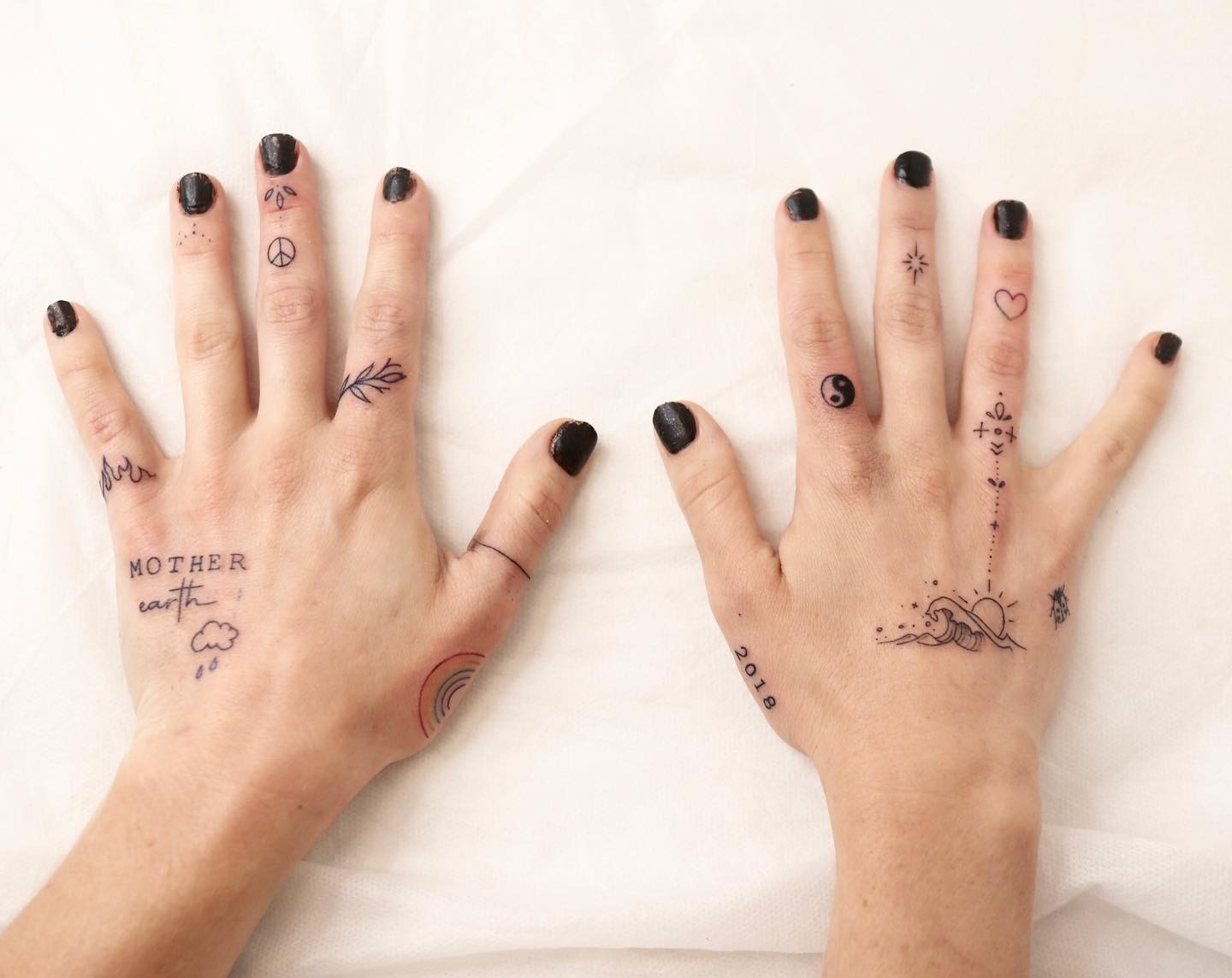 Fine Line Hand Tattoo