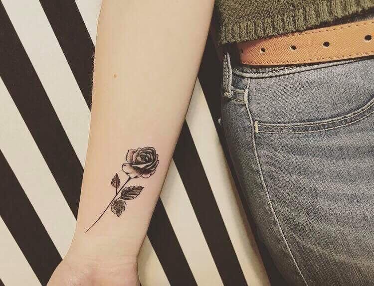 Small Black New Rose Tattoo With Stem And Leaves