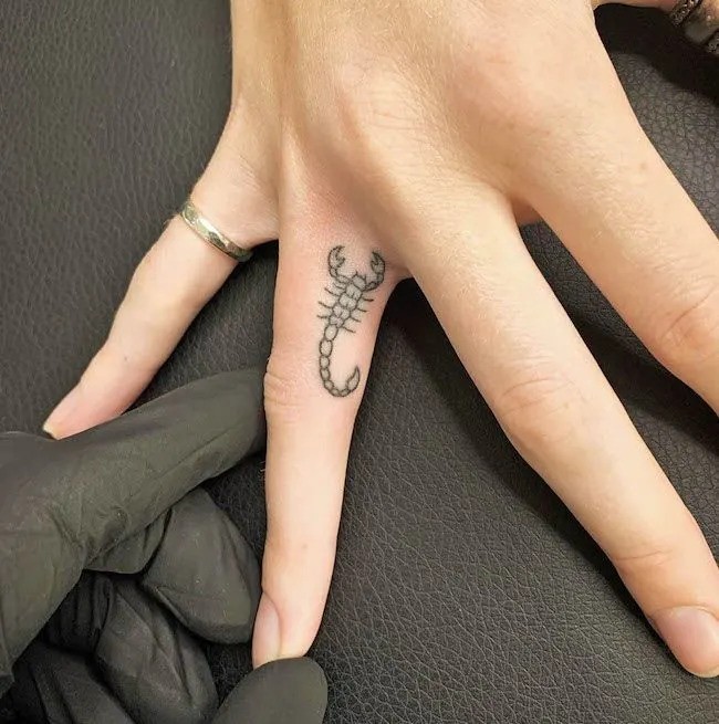 Finger Dot Tattoo