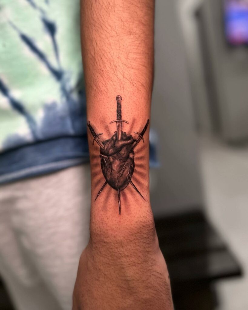 Realistic Heart And Dagger Tattoo