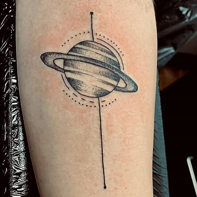 Black And Gray Dotwork Tattoo Saturn And Rings Design On Hand