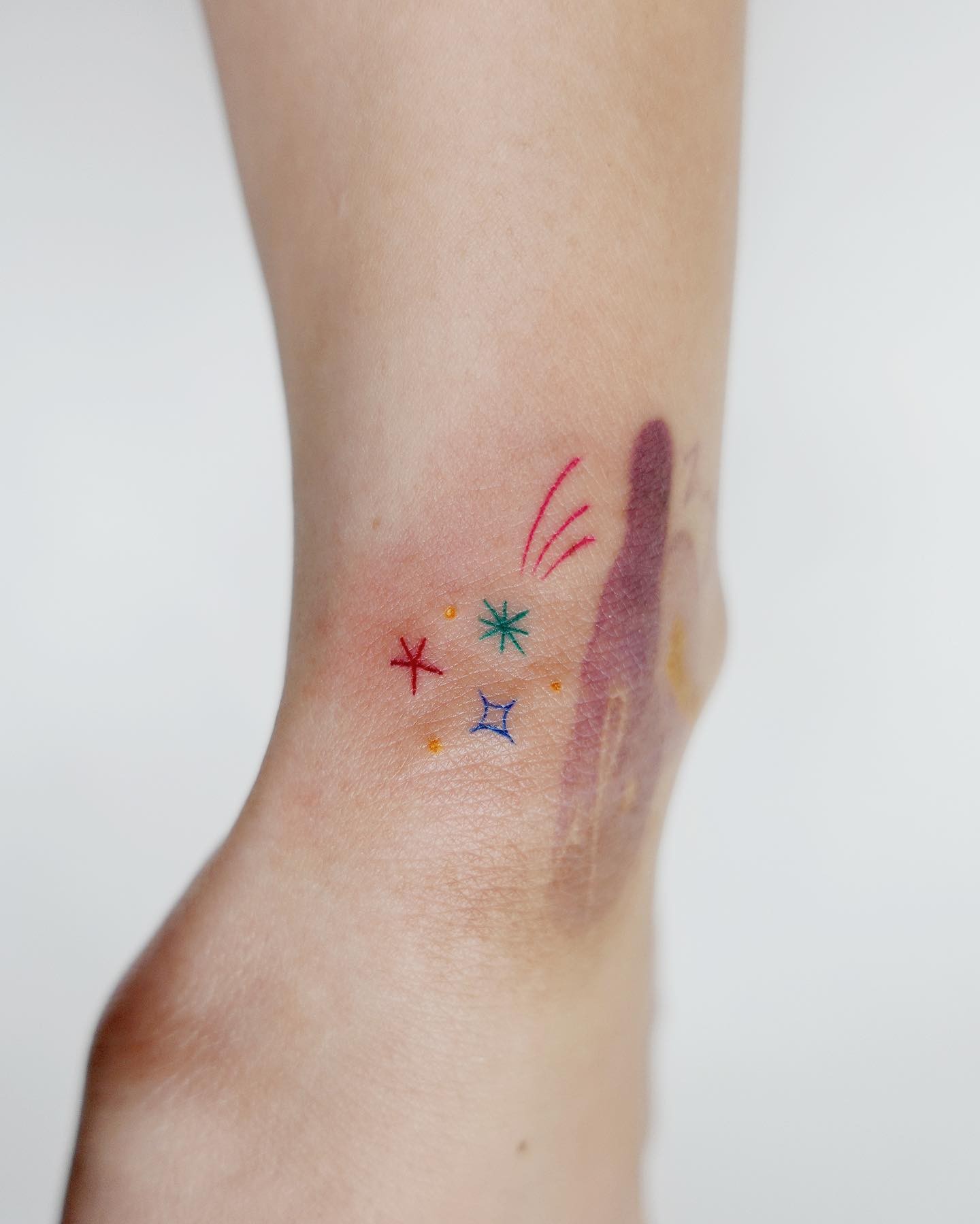 Colourful, Small, And Minimalistic Shooting Star Tattoo