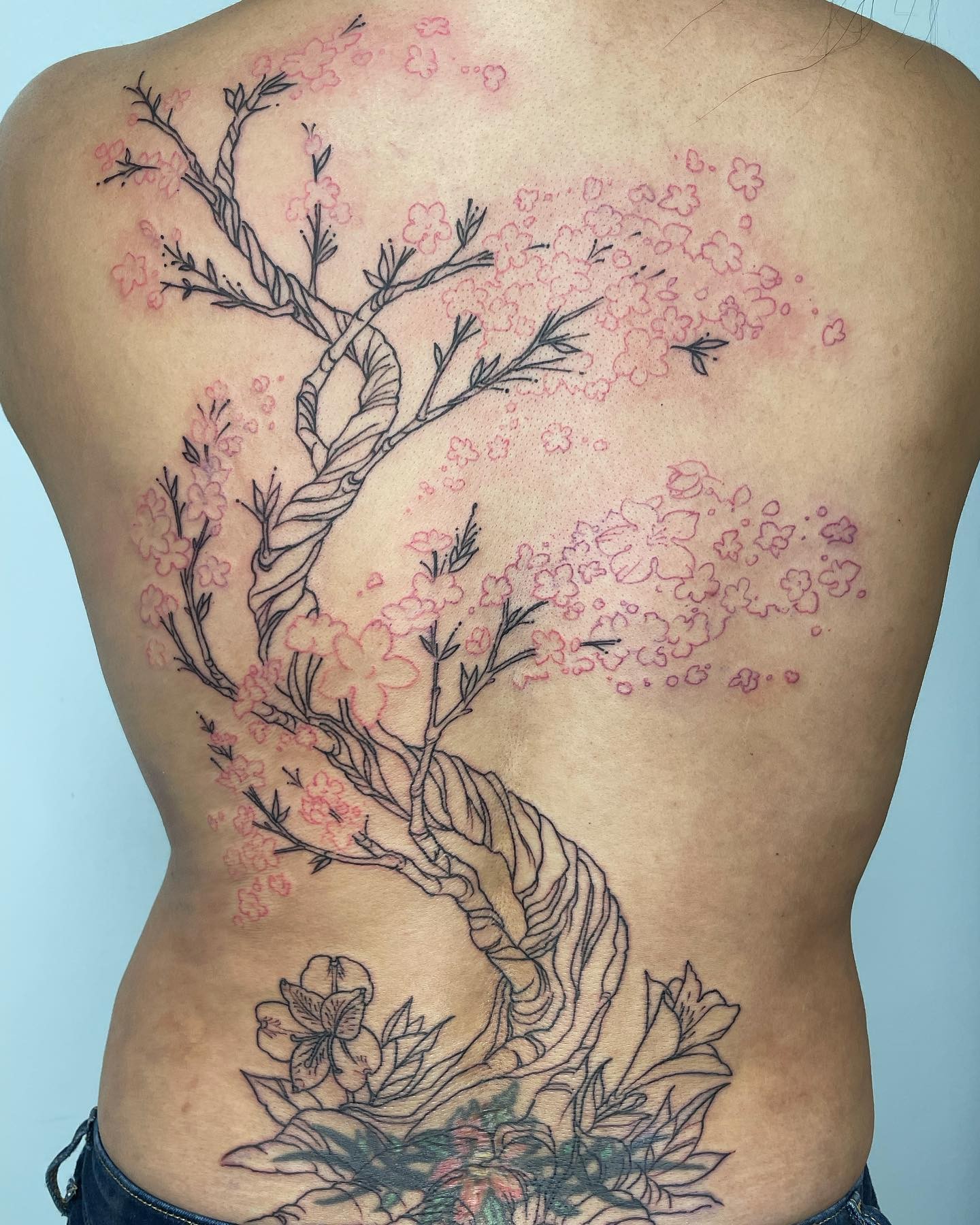 Cherry Blossom Lower Back Tattoo