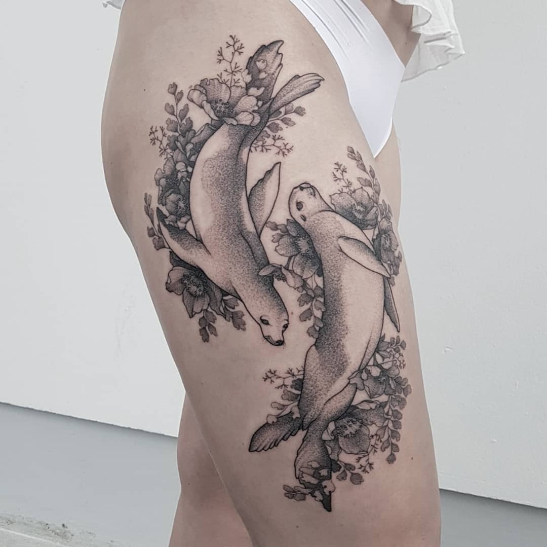 This Flowery Tattoo Of Two Seals