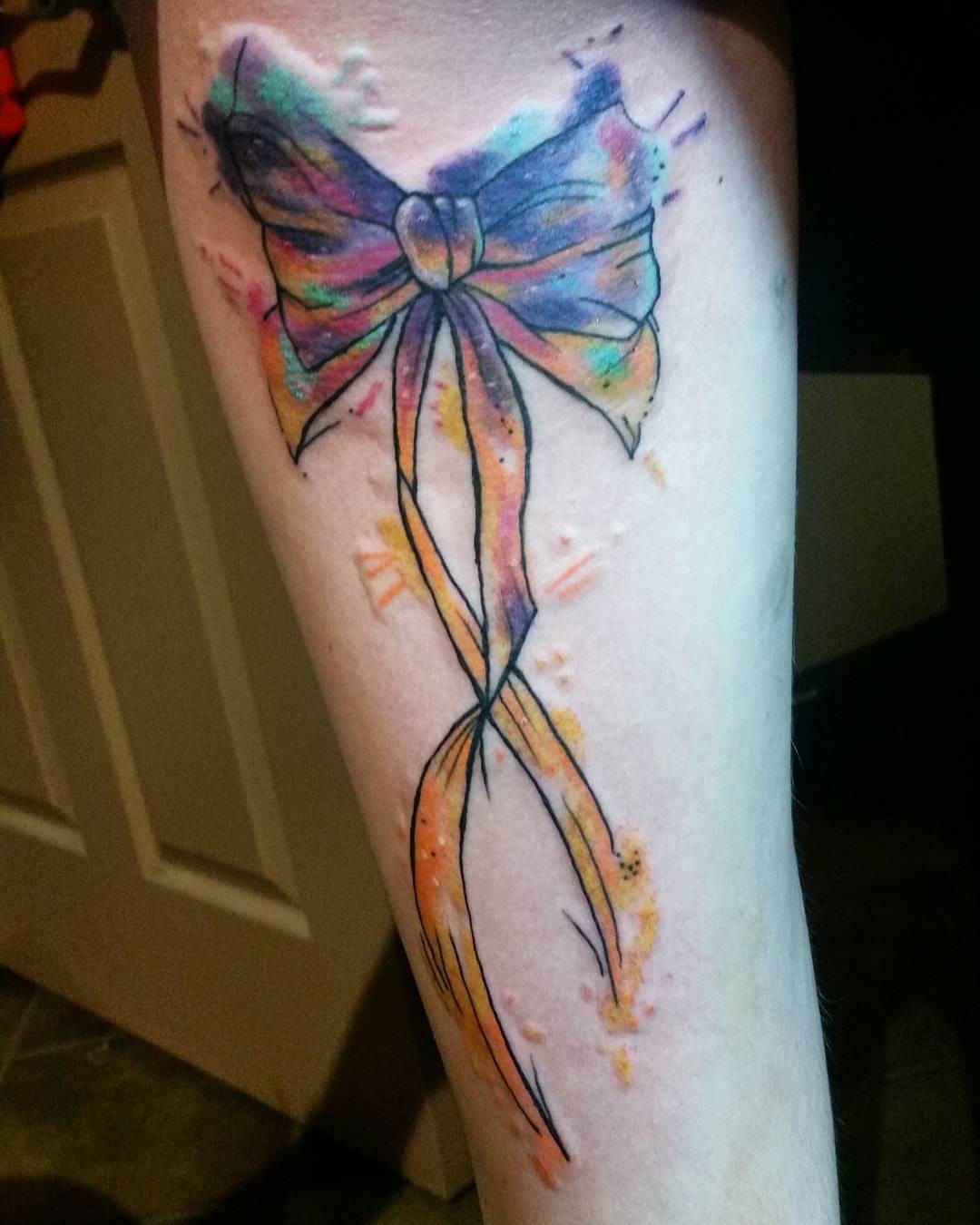 Color Splashes Thin Ribbon Bow Thigh Tattoo