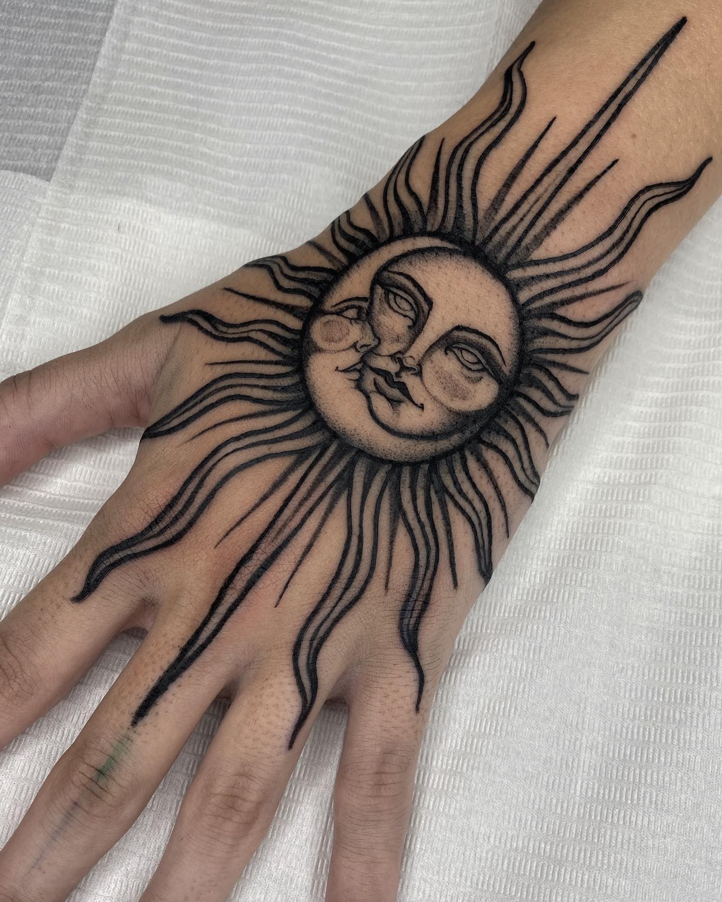 Sun & Moon Hand Tattoo