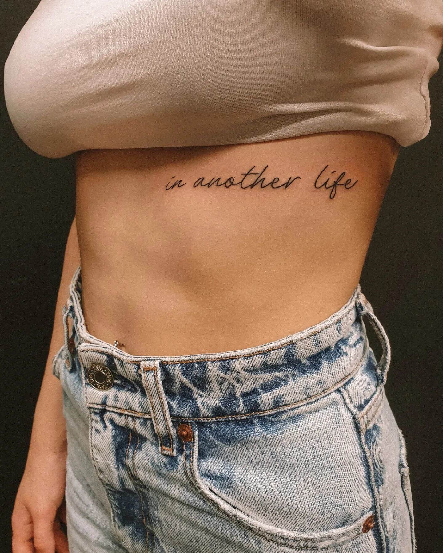 Cursive Lettering Underboob Tattoo