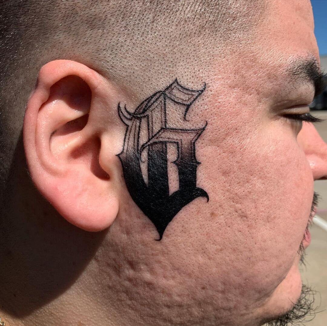 The Facial G Initial Tattoo